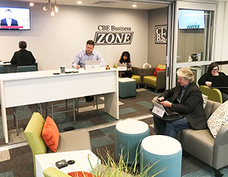 a workshare office with various people handling their business affairs